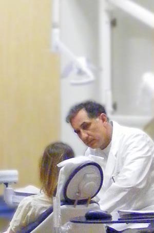 Dr Barnar examining patient